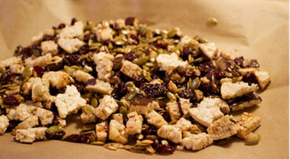 Granola with rice cakes, yogurt, and blueberries.